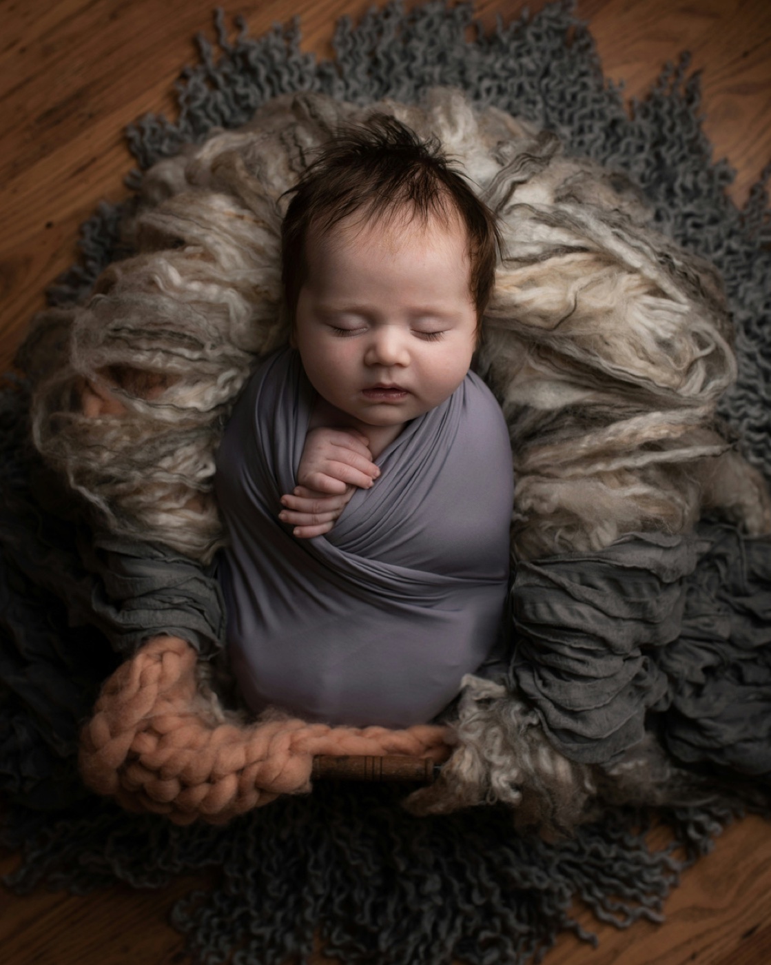 Newborn baby photoshoot with premium wrap and soft prop
